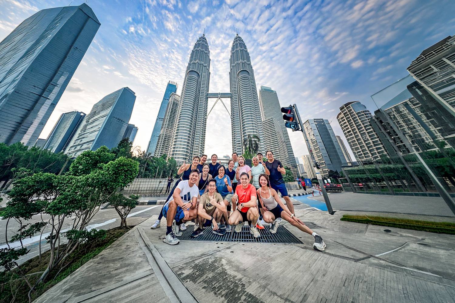 A Crestbrick investor group at KLCC beneath the Petronas Twin Towers